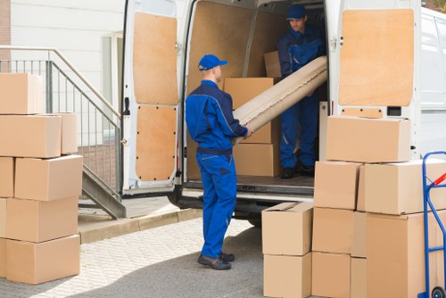 Removal team planning a house move in Hackney street