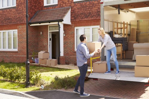 Man and van loading items into a moving van