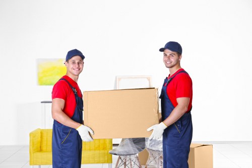 Furniture and household items being transported in a Hackney moving van