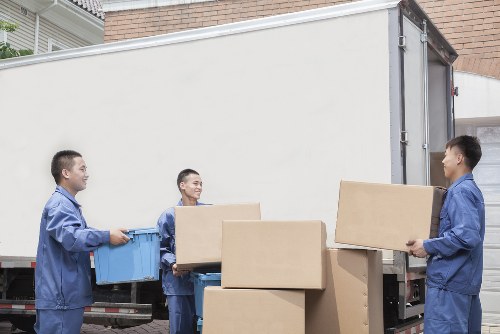 Team loading household items into a removals van in Hackney