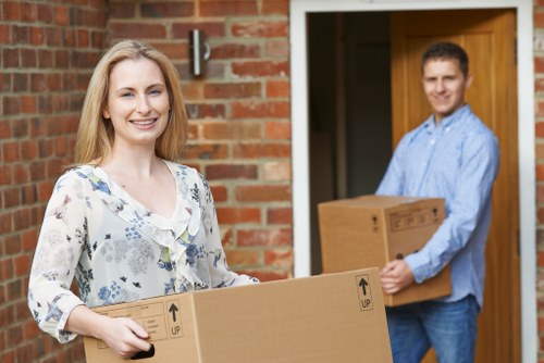 Packed boxes and furniture ready for collection during a Hackney home removal