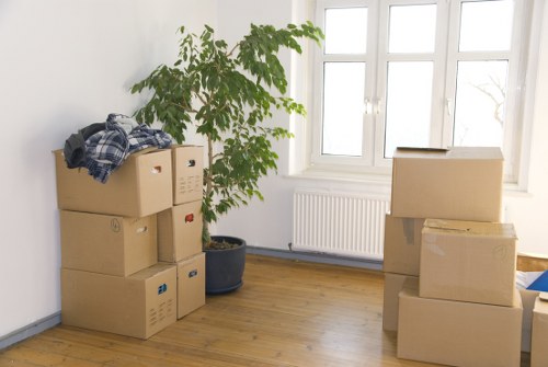Professional movers handling furniture for a flat move in Hackney