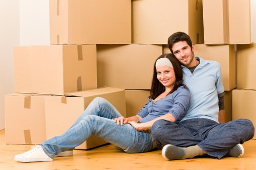 Removal van and moving team in a Hackney residential street
